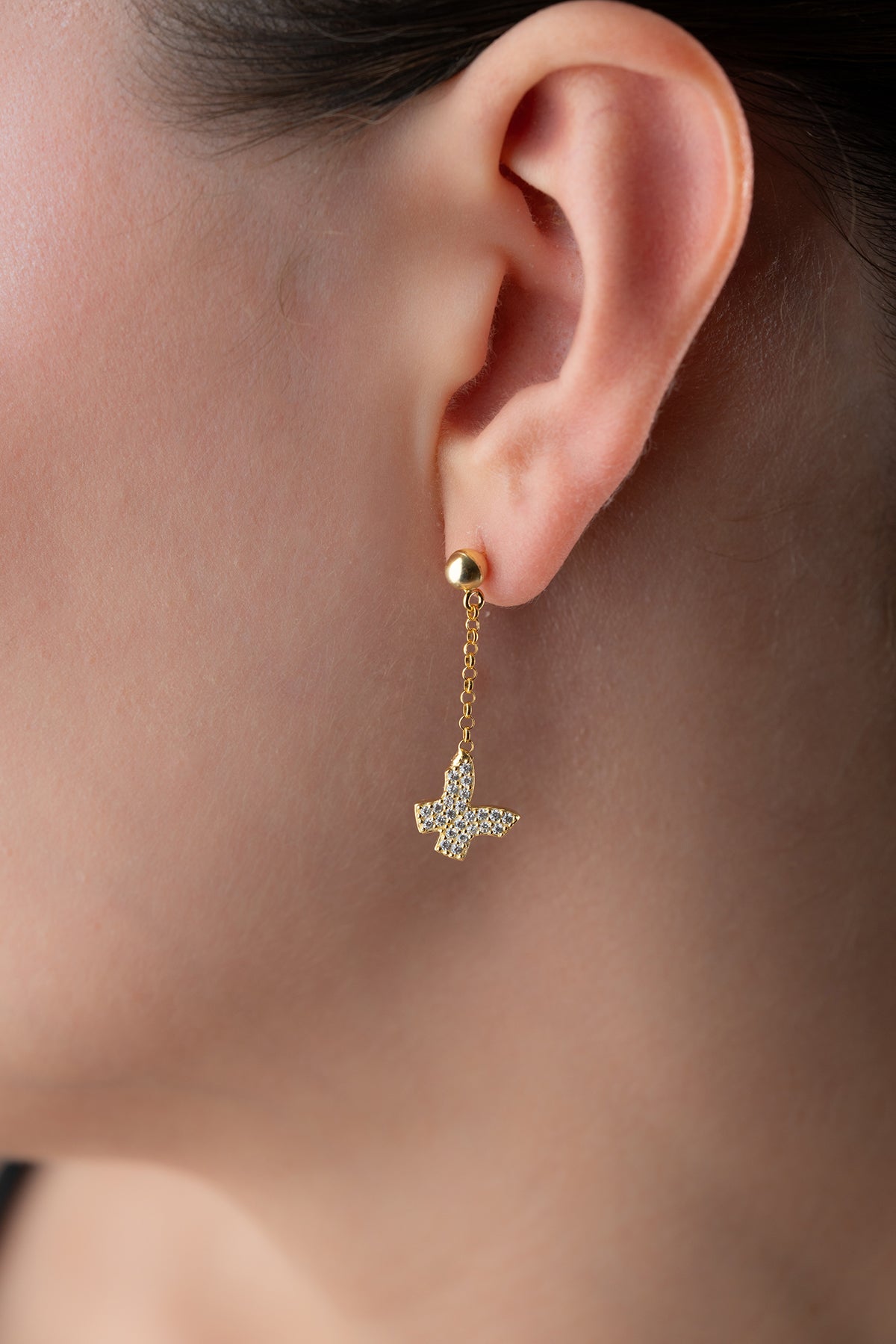 Boucles d'oreilles brillantes avec chaîne